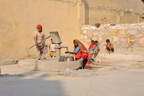 Woman and children collecting water