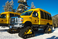 Snow coaches at a rest stop