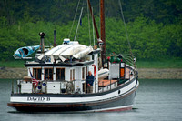 Cruising boat anchored in cove