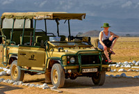 Julia sits on the Safari vehicle