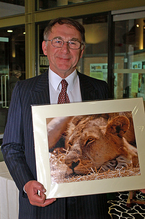 Michael Huggan with one of his Wildlife images at the Born Free event, London
