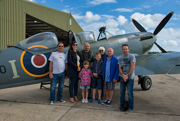 Paul and the family in front of the Spitfire