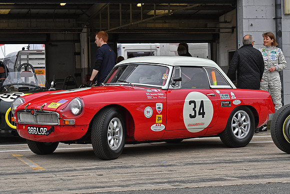 Beverley Phillips behind her MGB