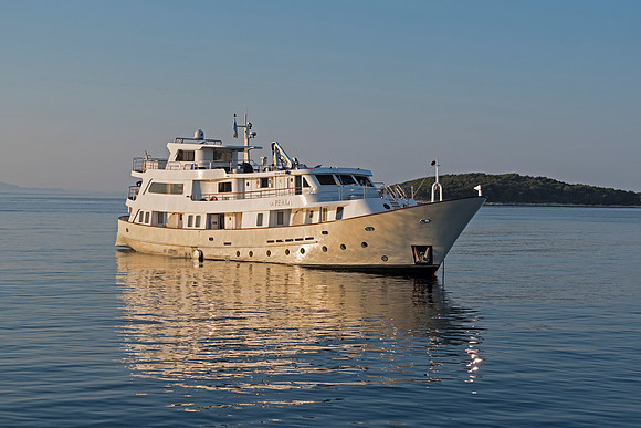 Yacht in morning light at Havar