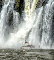 The leading tourist boat just about to enter the falls at Iguazu Falls, Brazil .094