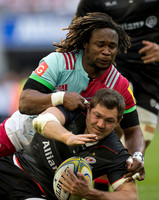 Maryland Yarde of Harlequins tackles a Saracens player