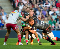 Joel Conlon (20) of Saracens tackes for the ball