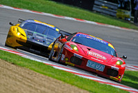 Ferrari 458 of the TEVA team leads Kessel's Ferreri 458 at Brands Hatch