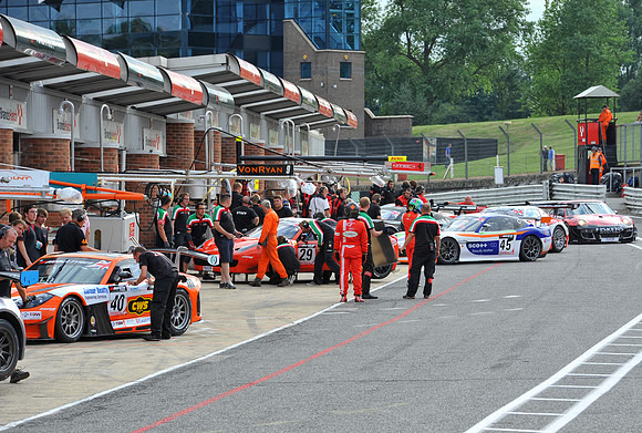 GT cars returning to the pit lane after a practice session in the GT Championships
