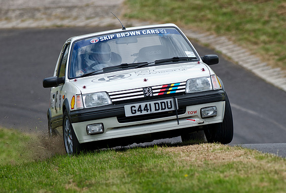 James Kew on the bank in his Peugeot 205 GTI at Gurston Down