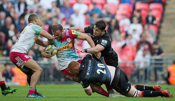 Dave Ward of Saracens pulls down a Harlequin player